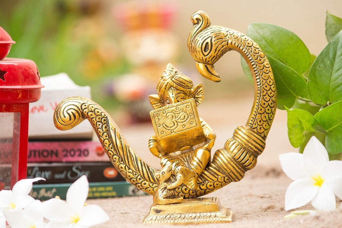 Cute Baby Ganesha Reading Book Idol