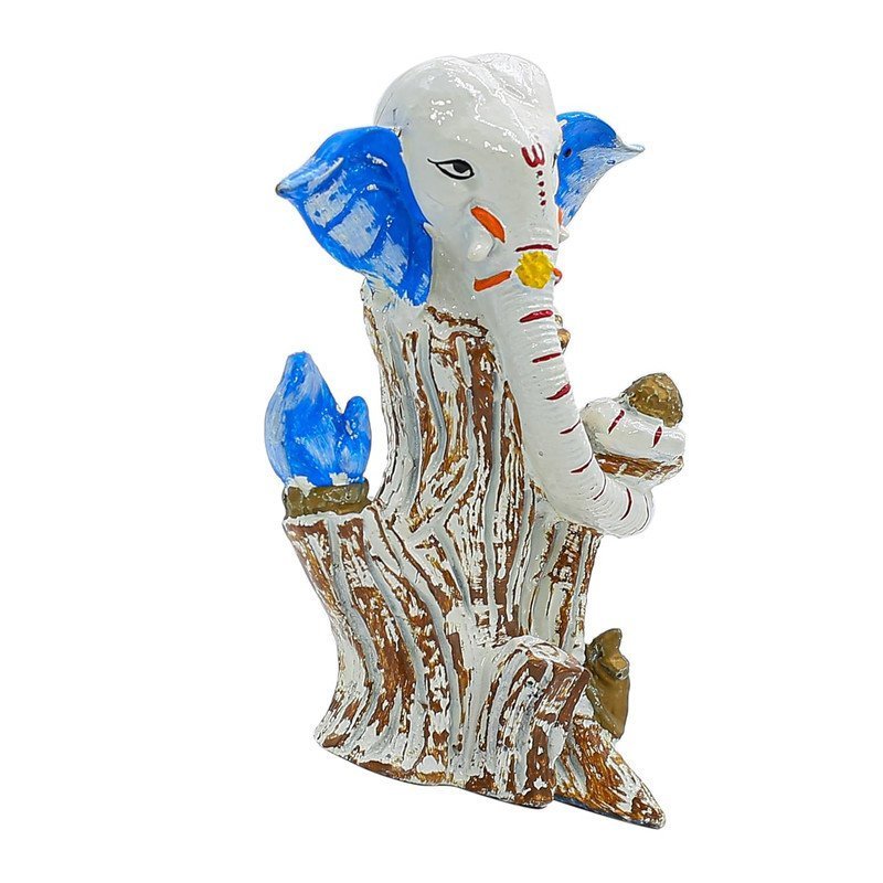 White & Blue Lord Ganesha Idol on Tree Log