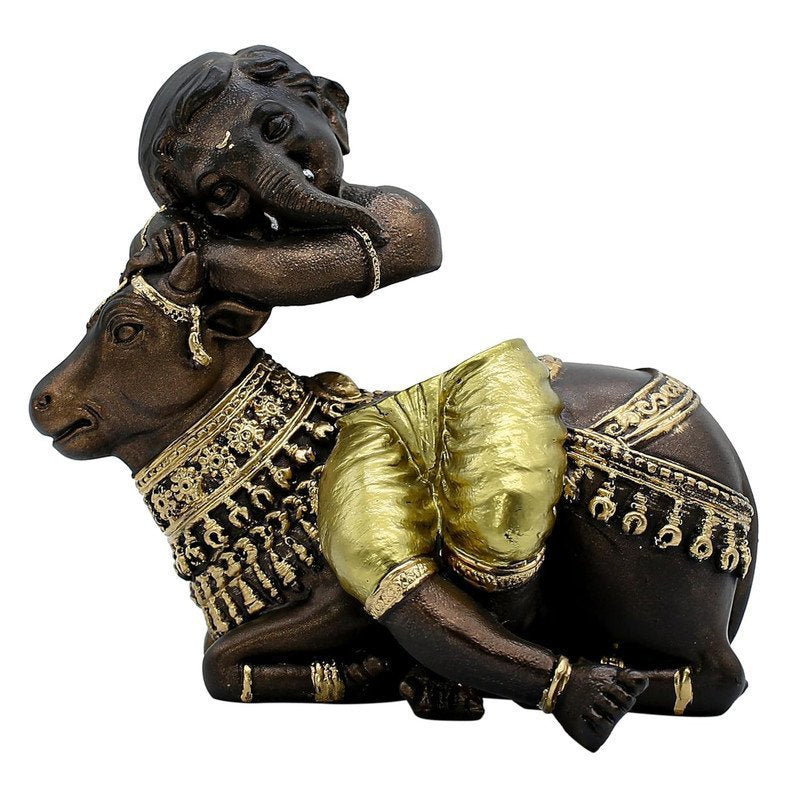Baby Ganesha Idol Resting on Cow Antique with Golden Dhoti