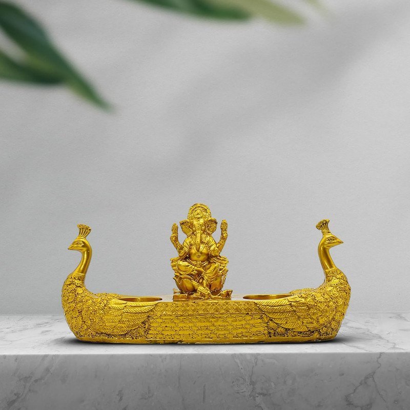 Lord Ganesha Idol with Twin Peacock Diya Stand Golden Polyresin Ganpati Showpiece for Home Temple Decor & Festive Lighting 10 Inch