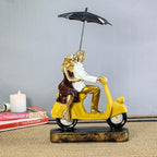 Romantic Couple Riding Yellow Scooter Statue - A Symbol of Love and Adventure