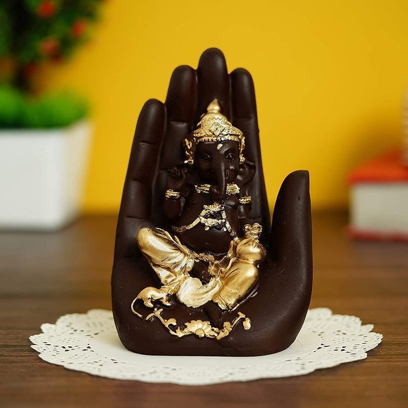 Elegant Black & Gold Ganesha Idol in Hand Design