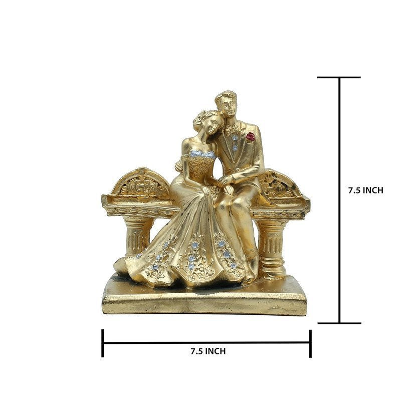Golden Couple on a Bench Statue