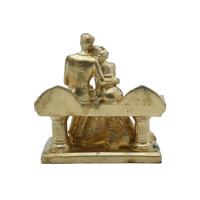 Golden Couple on a Bench Statue