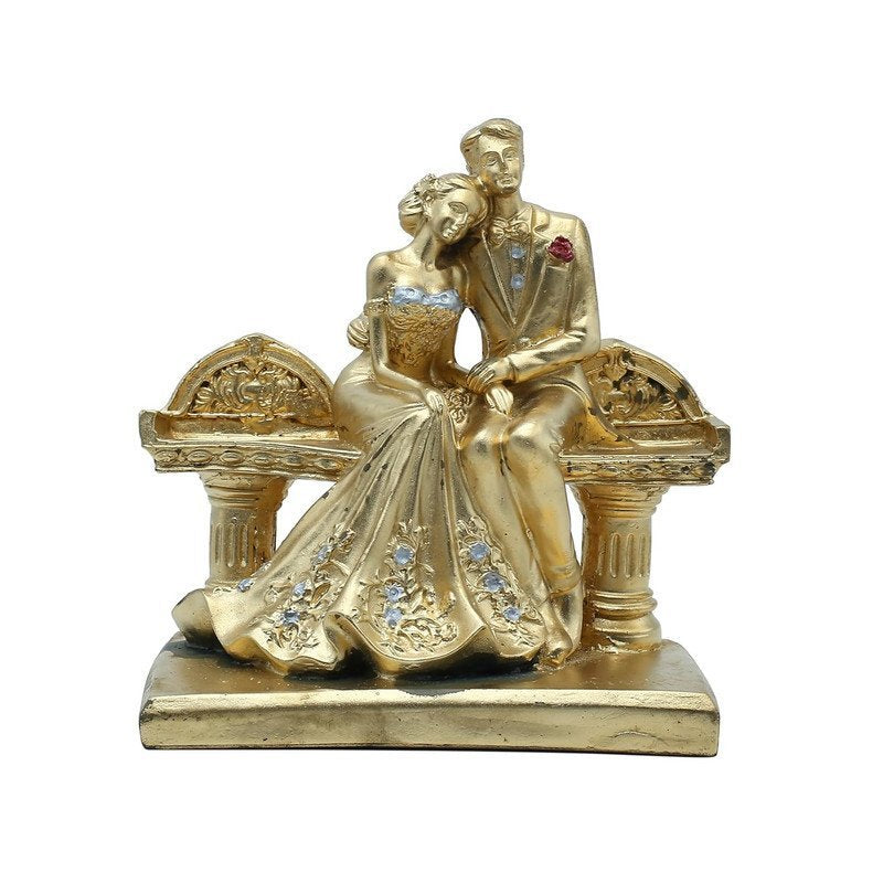Golden Couple on a Bench Statue