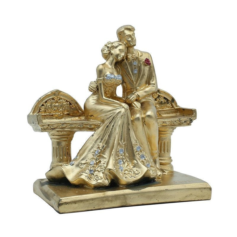 Golden Couple on a Bench Statue